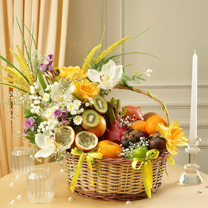 Exotic Bloom Basket featuring fresh tropical fruits, passion fruit, kiwi, dragon fruit, oranges, mangosteen, and elegant floral arrangements in a luxury woven basket by Fruitilicious.