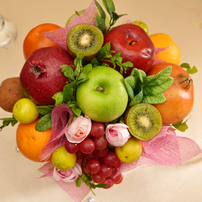 Fruit and flower arrangement on a beige background