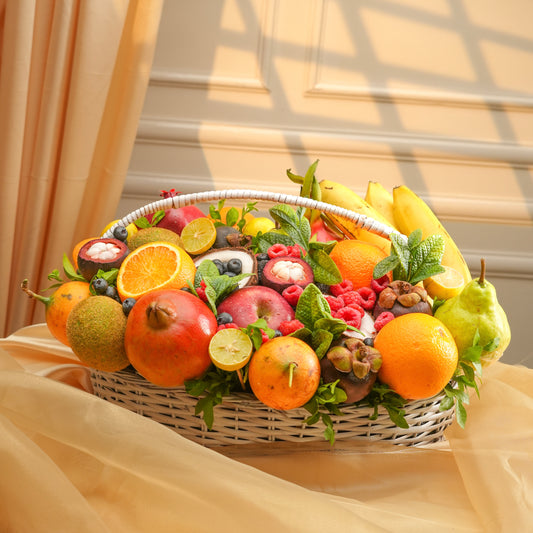 Fruit basket with various fruits on a beige fabric background