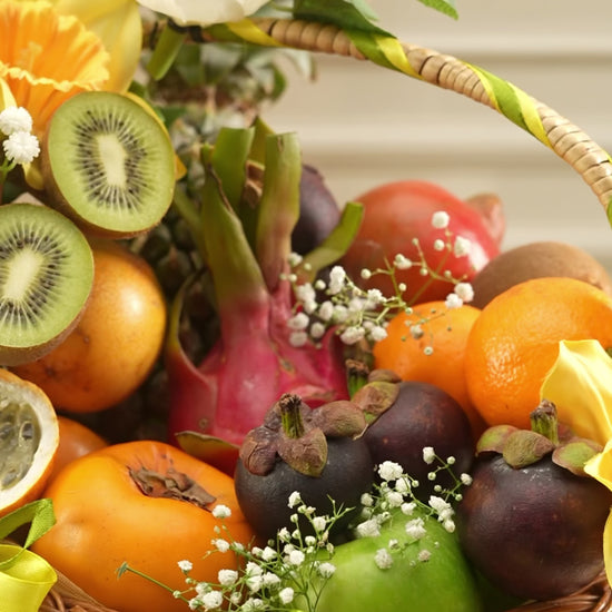 Luxury Exotic Bloom Basket by Fruitilicious featuring fresh tropical fruits, elegant floral arrangements, and premium gifting aesthetics showcased in a beautifully styled celebration setup.